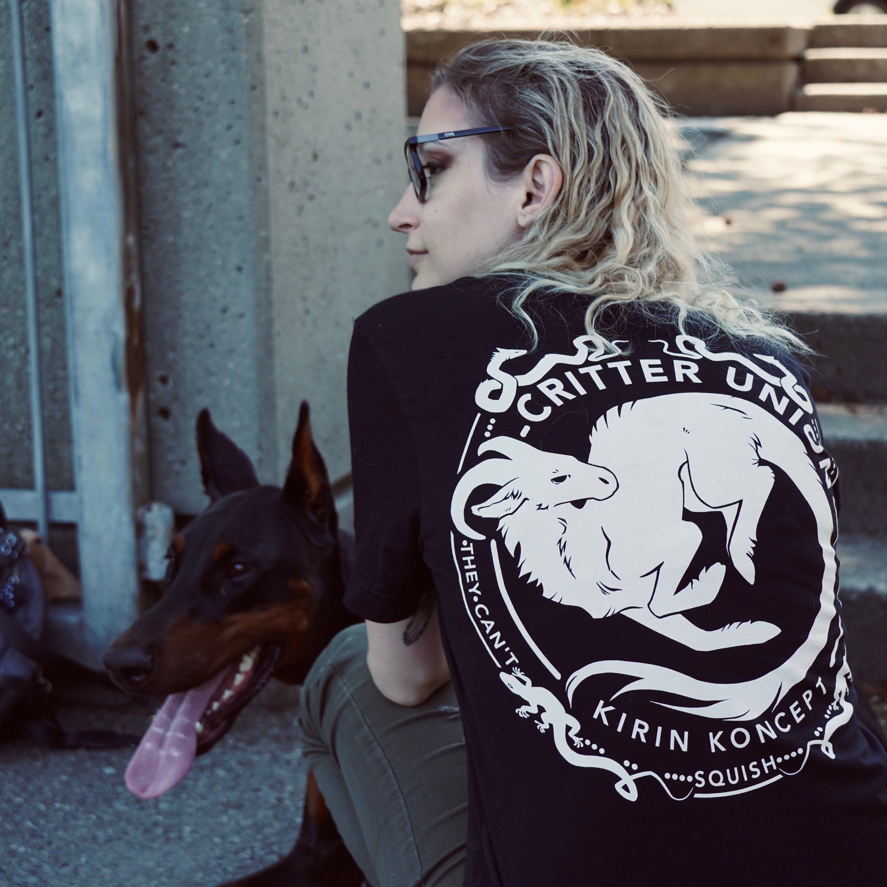Black plain shirt with white design in the back critter union original artist design