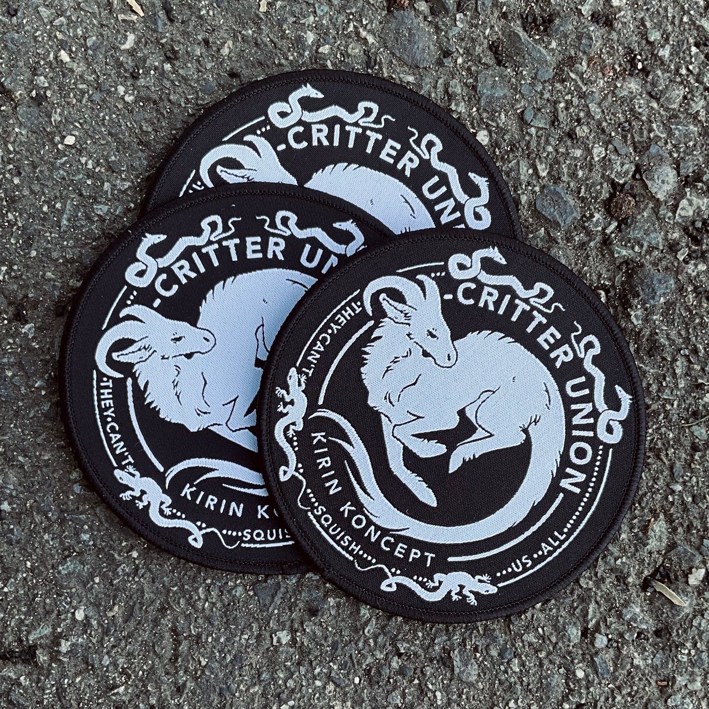 Black embroidered woven critter union patch